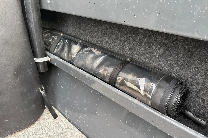 Slide: The Image of 2019 Fish Rite Stalker boat interior storage compartment with protective cover. - 52