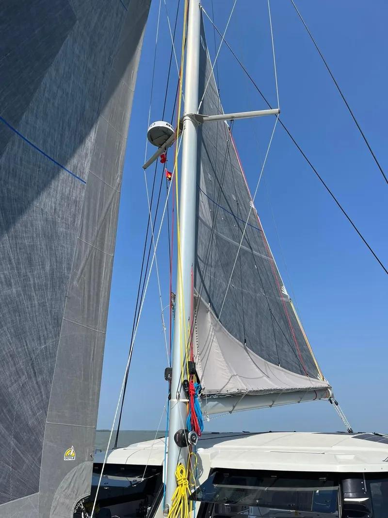 Slide: The Image of Sailing yacht Seawind 1370, 2026 model, with sails unfurled against a clear blue sky. - 11