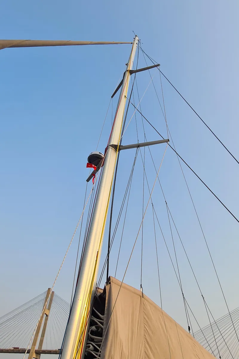 Slide: The Image of Sailboat mast of 2026 Seawind 1370 against clear blue sky. - 12