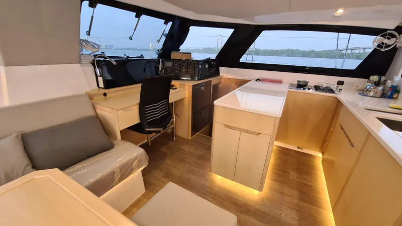 Slide: The Image of Modern interior of 2026 Seawind 1370 yacht with sleek design and wooden flooring. - 14