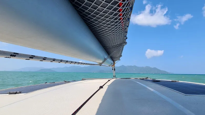 Slide: The Image of Sailing on a 2026 Seawind 1370 catamaran with clear blue skies and ocean views. - 4