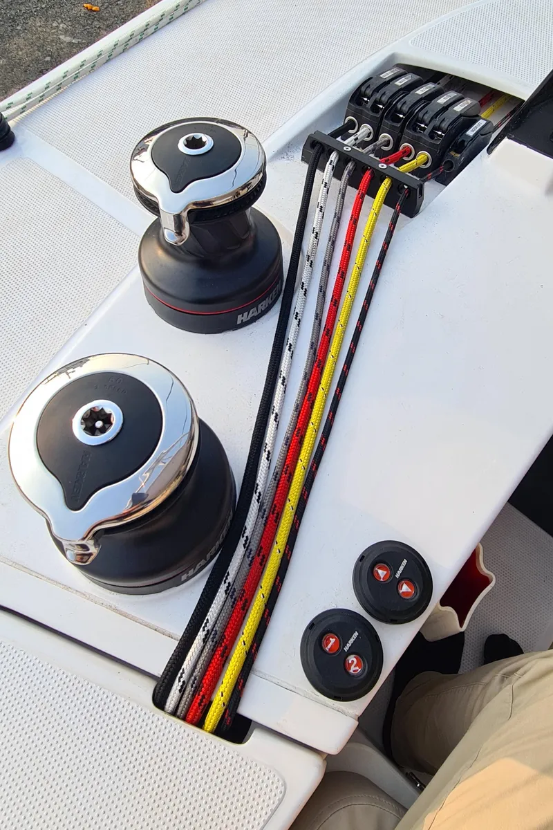 Slide: The Image of 2026 Seawind 1370 sailboat winches and colorful ropes on deck. - 5