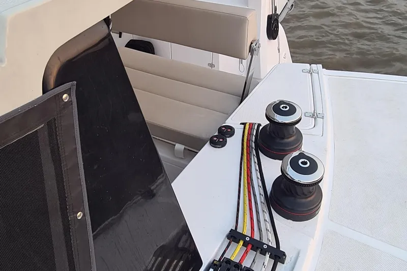 Slide: The Image of Deck view of 2026 Seawind 1370 catamaran with winches and seating area. - 8