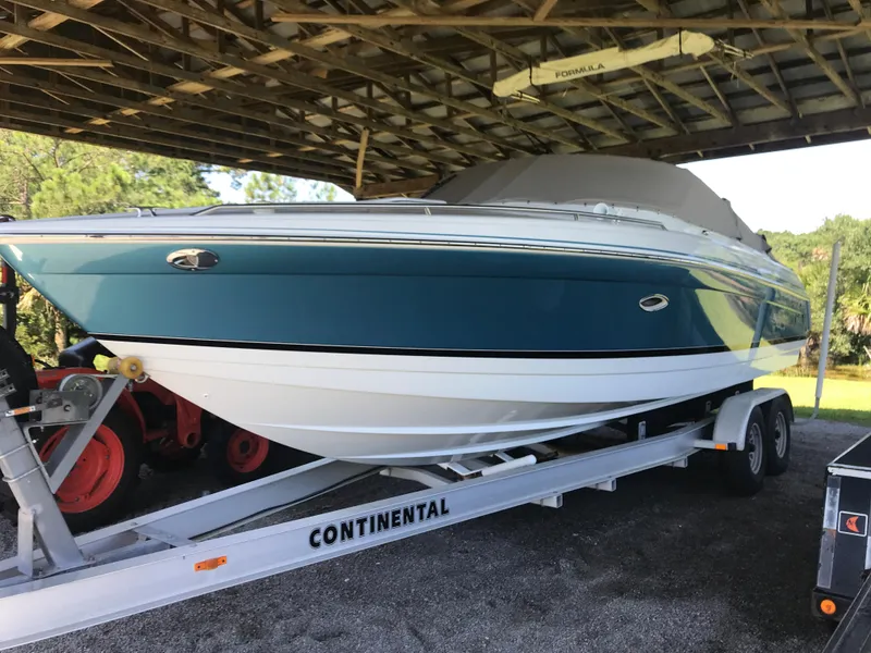 Slide: The Image of 2005 Formula 280 Sun Sport boat cruising on open water. - 0