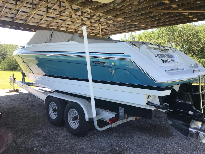 Slide: The Image of 2005 Formula 280 Sun Sport boat cruising on open water. - 1