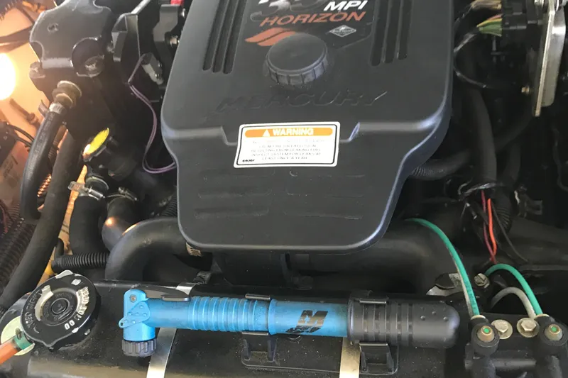 Slide: The Image of Interior of 2005 Formula 280 Sun Sport boat with beige seating and wood accents. - 27