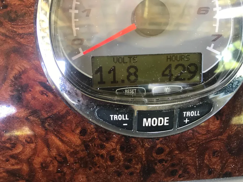Slide: The Image of Interior view of 2005 Formula 280 Sun Sport cabin with wood paneling and control panel. - 31