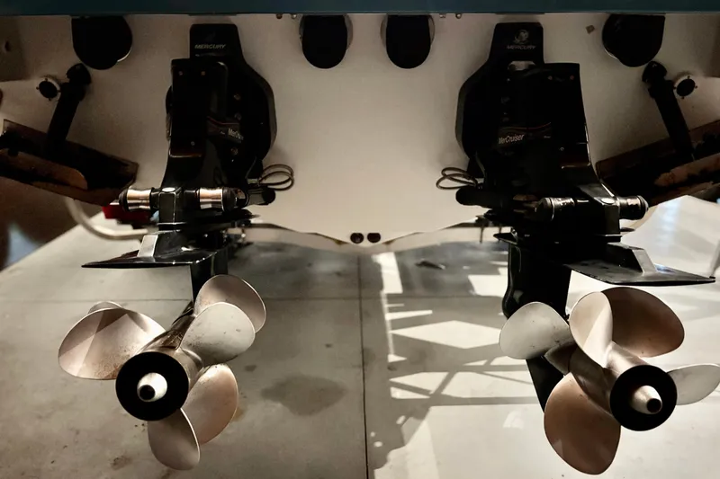 Slide: The Image of 2005 Formula 280 Sun Sport boat propellers and outdrives, close-up view. - 44
