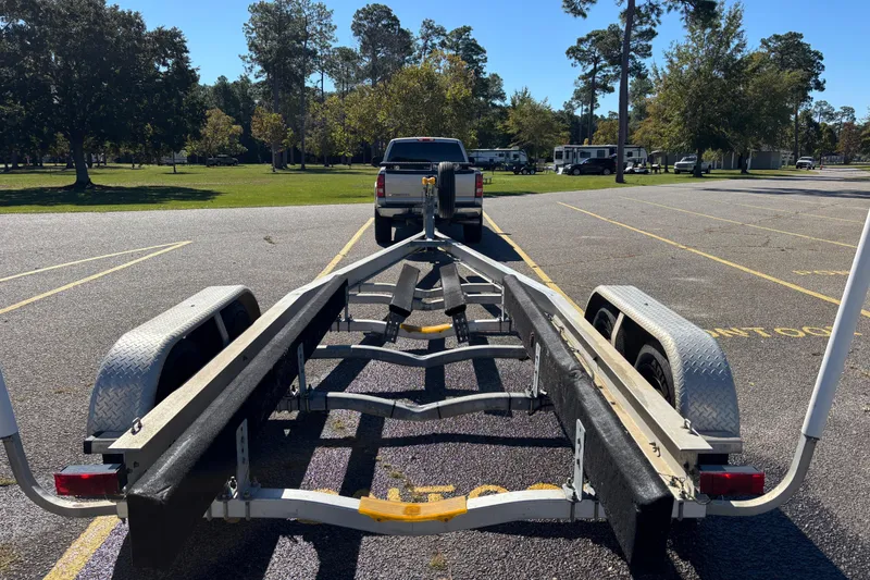 Slide: The Image of Trailer for 2005 Formula 280 Sun Sport in parking lot with truck. - 46