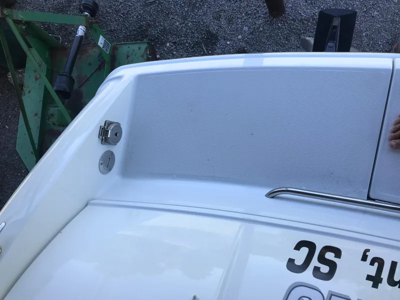 Slide: The Image of 2005 Formula 280 Sun Sport boat on trailer by a lake, under clear blue sky. - 5