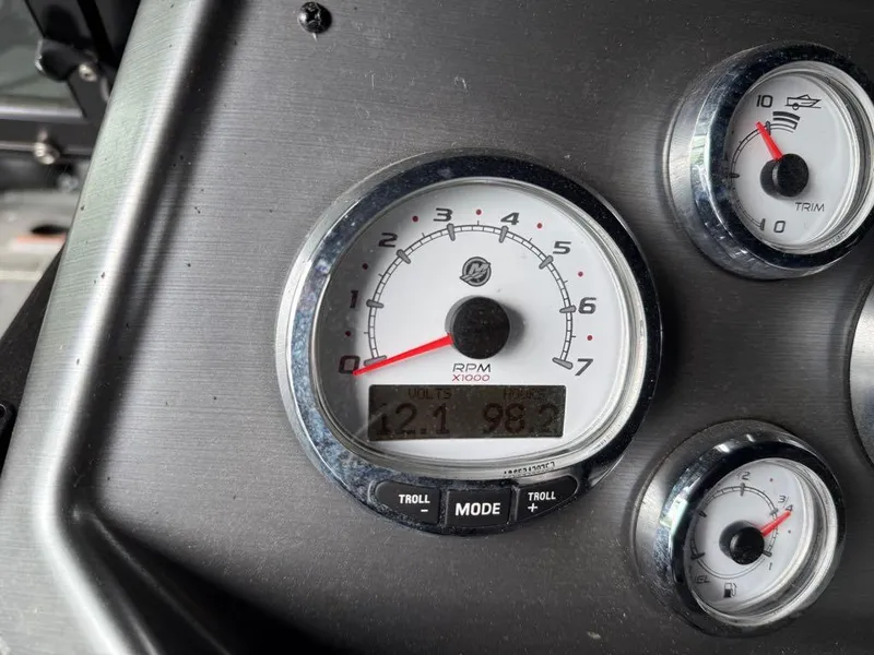 Slide: The Image of Dashboard of 2021 Lund 1975 Tyee boat showing RPM and trim gauges. - 20