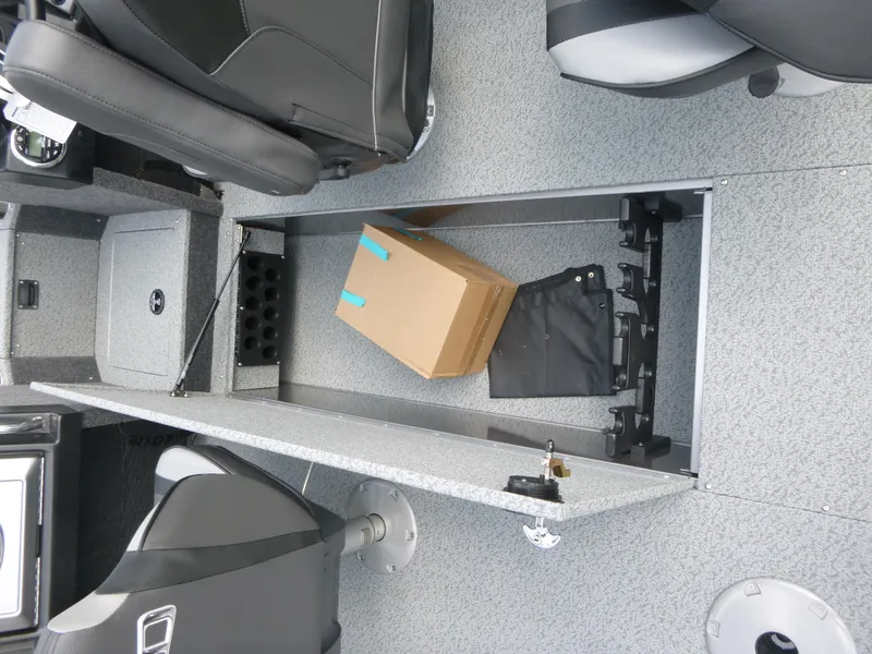 Slide: The Image of Interior of 2021 Lund 1975 Tyee boat showing storage compartment with box and accessories. - 33