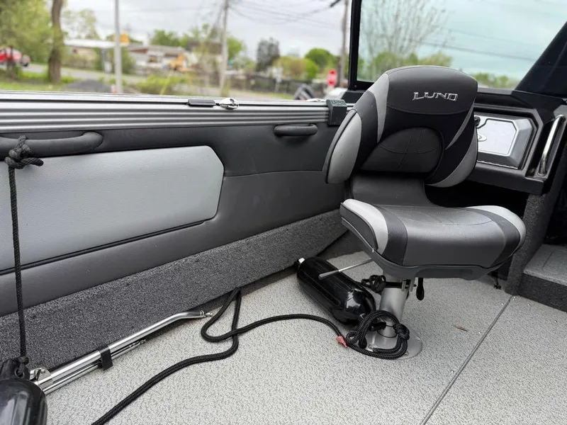 Slide: The Image of Interior of 2021 Lund 1975 Tyee boat with cushioned seat and sleek design. - 39