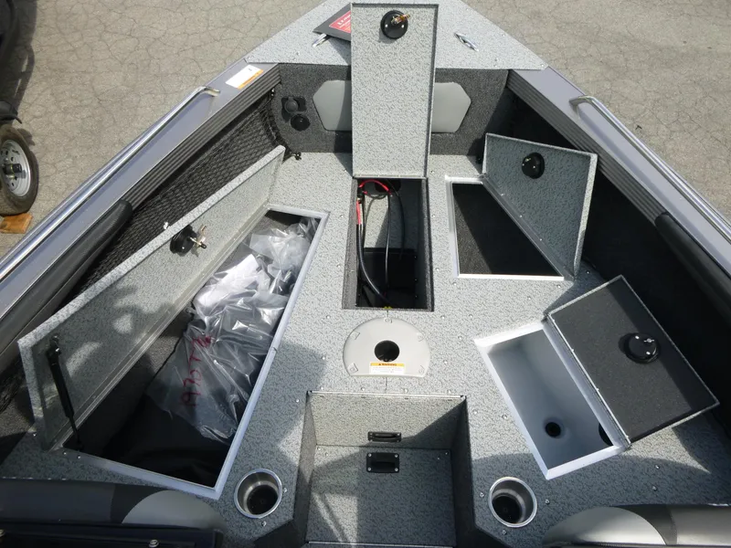 Slide: The Image of Open storage compartments on a 2021 Lund 1975 Tyee boat deck. - 9