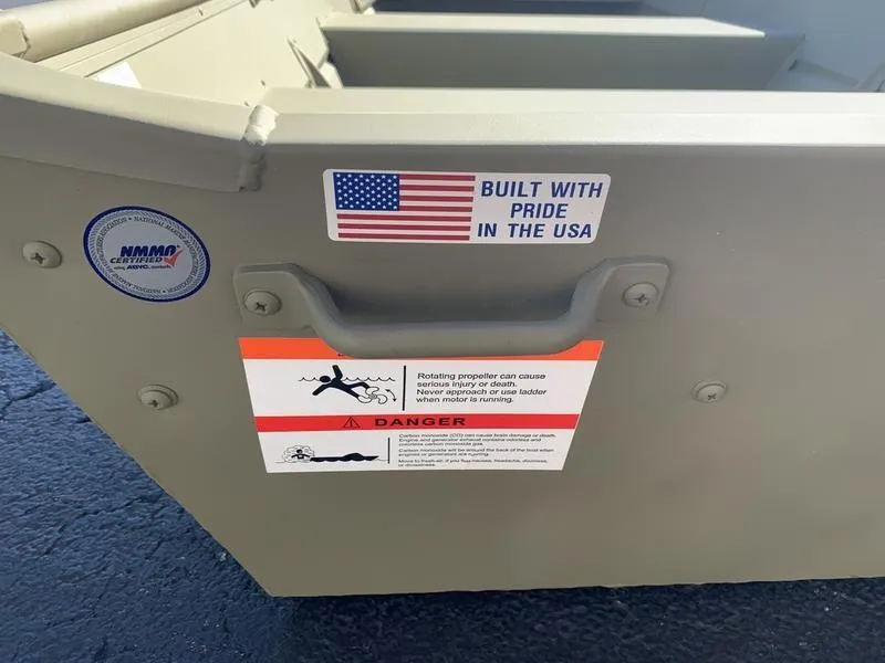 Slide: The Image of 2024 Lowe L1040 Jon boat with safety warning and "Built with Pride in the USA" sticker. - 5