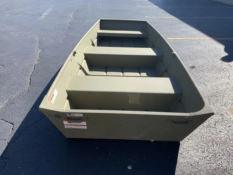 Slide: The Image of 2024 Lowe L1040 Jon boat on asphalt, showcasing its sturdy design. - 6
