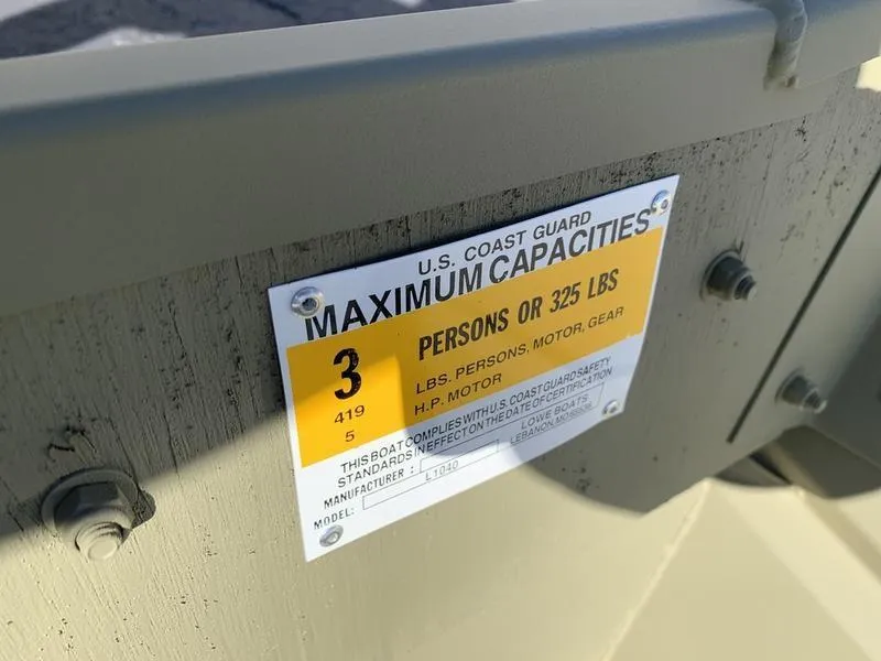 Slide: The Image of U.S. Coast Guard capacity label on 2024 Lowe L1040 Jon boat. - 9
