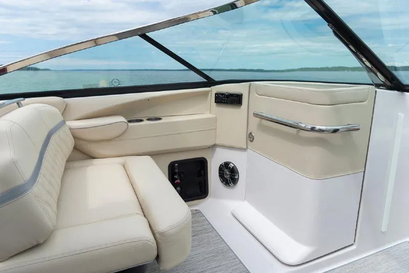 Slide: The Image of 2023 Regal 2800 Bowrider interior with beige seating and sleek dashboard design. - 11
