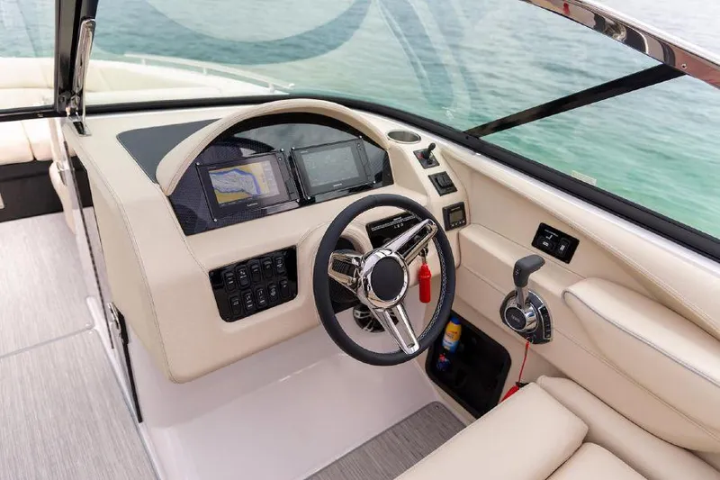 Slide: The Image of 2023 Regal 2800 Bowrider helm with modern controls and navigation system. - 9