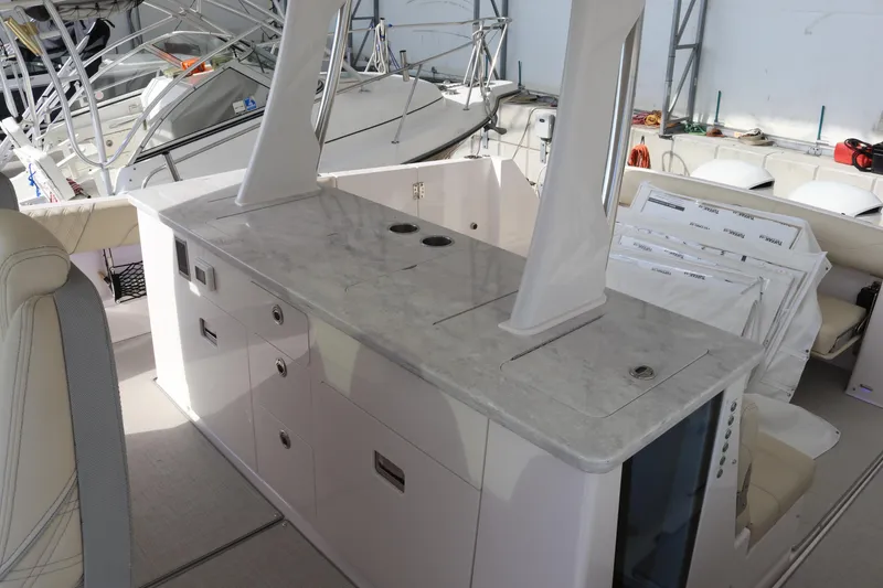 Slide: The Image of 2023 Regal 38 SAV yacht interior with sleek countertop and modern design elements. - 18