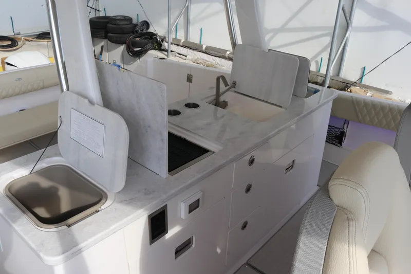 Slide: The Image of 2023 Regal 38 SAV yacht interior with modern kitchen and sink area. - 22