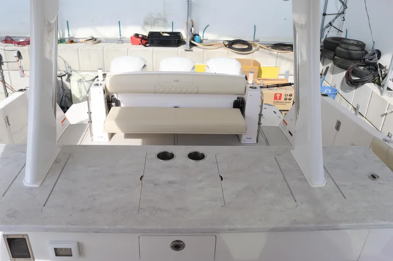 Slide: The Image of 2023 Regal 38 SAV boat interior with seating and storage compartments. - 24