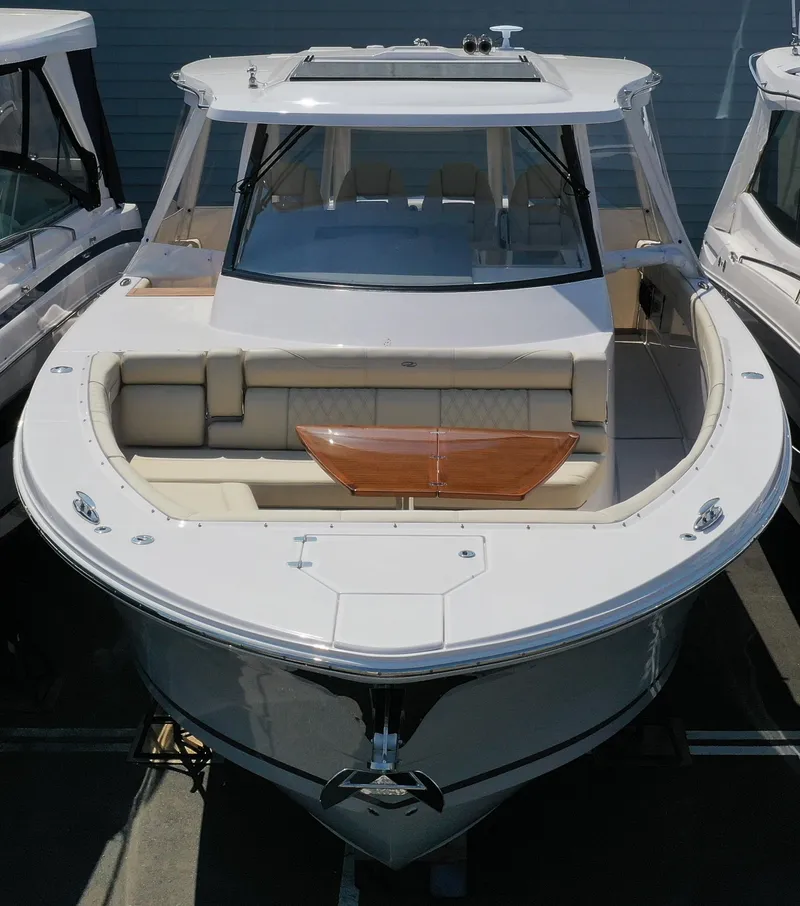 Slide: The Image of 2023 Regal 38 SAV luxury boat with sleek design and spacious seating. - 3