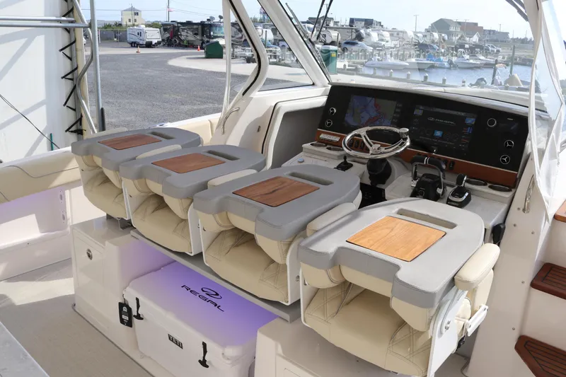Slide: The Image of 2023 Regal 38 SAV boat interior with modern helm and seating. - 31
