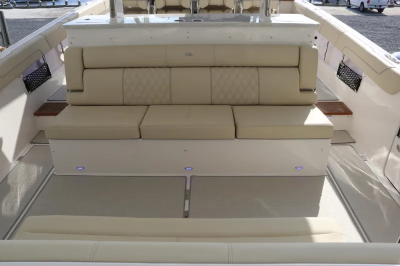 Slide: The Image of 2023 Regal 38 SAV boat interior with beige seating and modern design. - 35