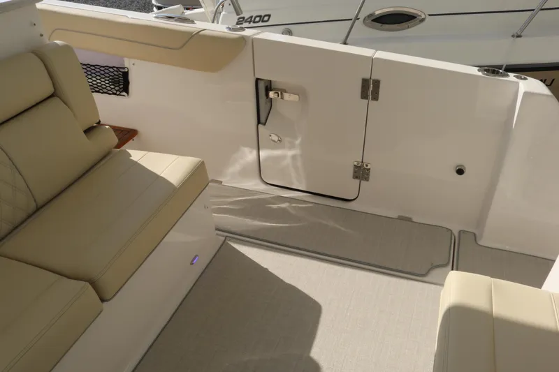 Slide: The Image of 2023 Regal 38 SAV boat interior with beige seating and sleek design. - 37