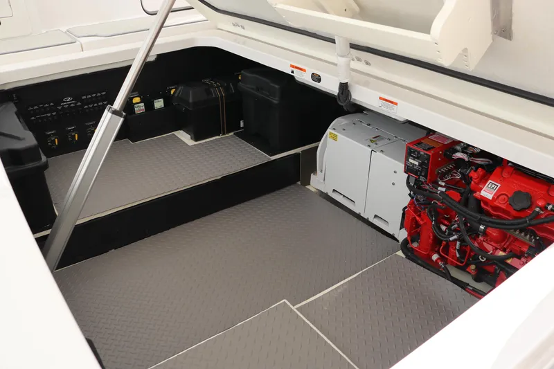 Slide: The Image of 2023 Regal 38 SAV engine compartment with red machinery and organized layout. - 40