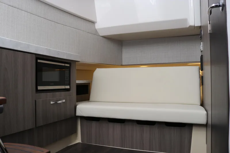 Slide: The Image of 2023 Regal 38 SAV interior with modern seating and built-in microwave. - 48
