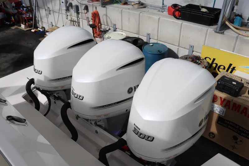 Slide: The Image of Three Yamaha outboard engines on a 2023 Regal 38 SAV boat. - 7