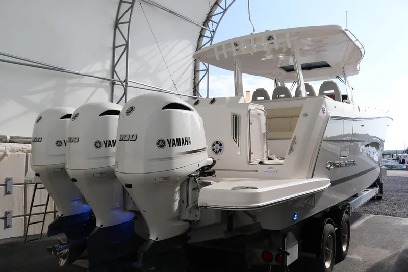 Slide: The Image of 2023 Regal 38 SAV boat with Yamaha outboard engines in a covered storage area. - 8