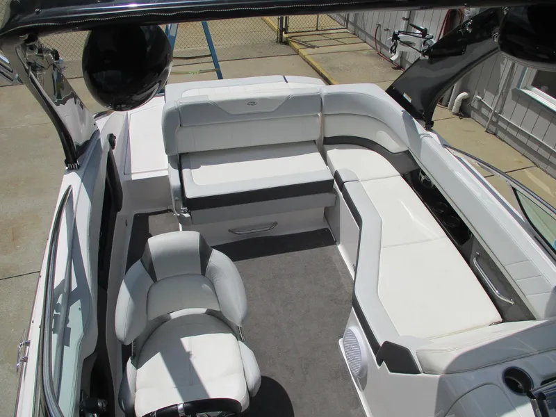 Slide: The Image of 2013 Regal 24 FasDeck RX boat interior with white seating and modern design. - 11