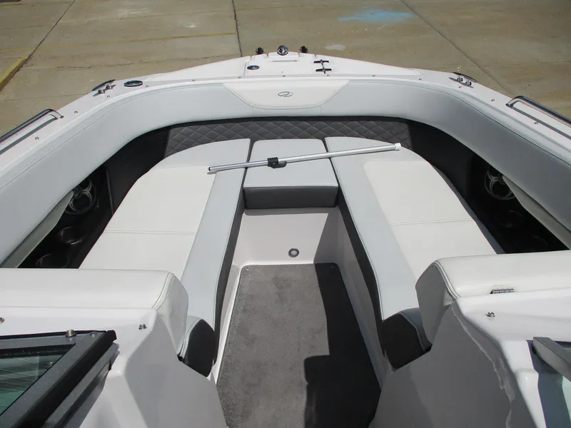 Slide: The Image of 2013 Regal 24 FasDeck RX boat interior with white seating and gray flooring. - 12