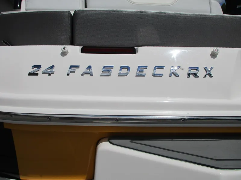 Slide: The Image of 2013 Regal 24 FasDeck RX boat rear view with model name displayed. - 14