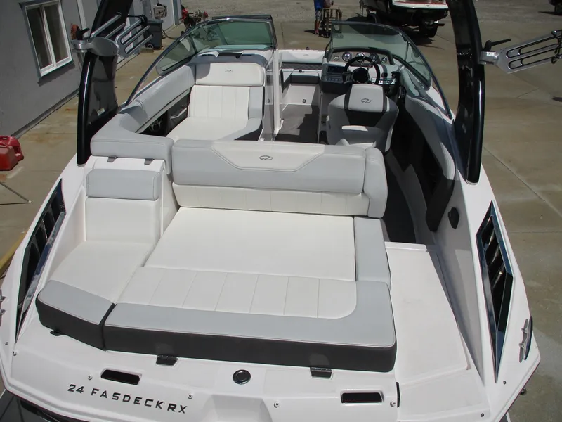 Slide: The Image of 2013 Regal 24 FasDeck RX boat interior with spacious seating and modern design. - 17