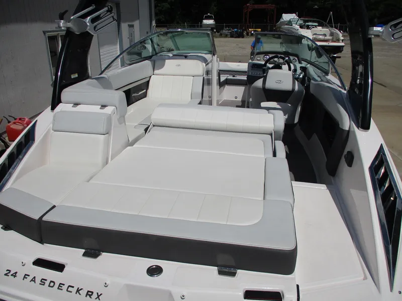 Slide: The Image of 2013 Regal 24 FasDeck RX boat with spacious seating and modern interior design. - 19
