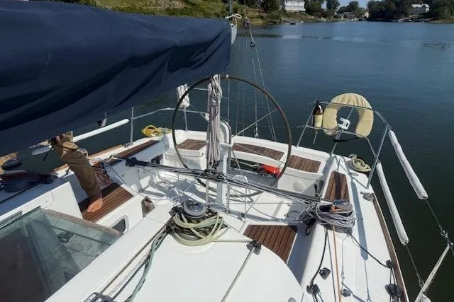 Slide: The Image of Sailing yacht Beneteau First 36.7, 2002 model, with spacious cockpit and scenic waterway view. - 11