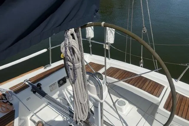 Slide: The Image of Beneteau First 36.7 sailboat cockpit, 2002 model, featuring a steering wheel and ropes. - 12