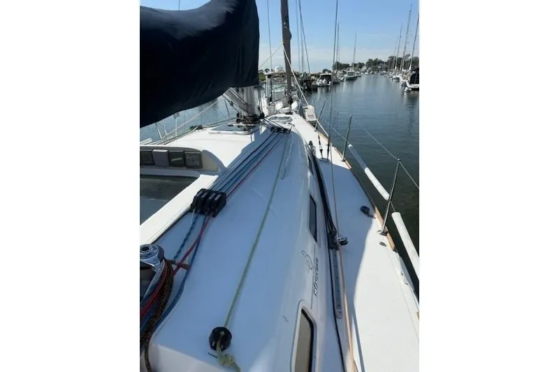 Slide: The Image of Sailboat deck view of 2002 Beneteau First 36.7 in marina setting. - 13
