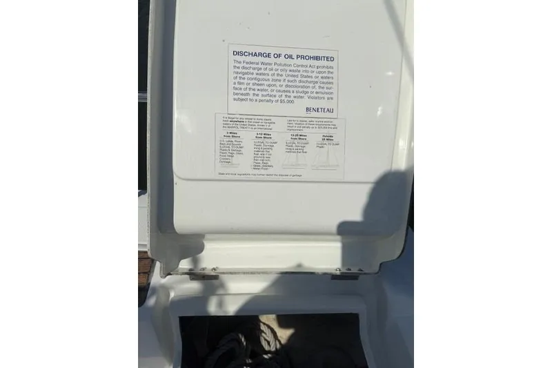 Slide: The Image of Beneteau First 36.7 yacht, 2002 model, oil discharge prohibition notice on deck. - 16