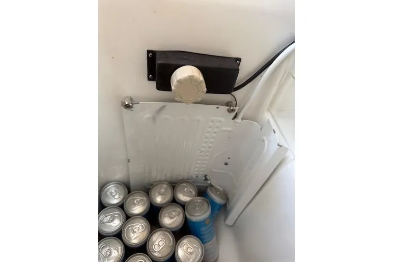 Slide: The Image of Refrigerator interior with beverage cans, Beneteau First 36.7, 2002 model. - 21