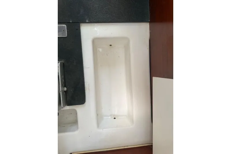 Slide: The Image of Interior detail of a 2002 Beneteau First 36.7 sailboat, featuring a white compartment. - 35