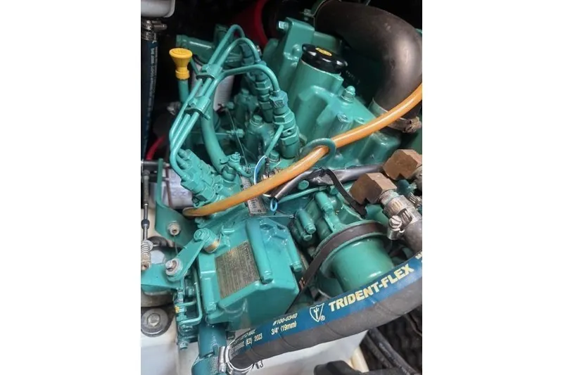 Slide: The Image of Engine of a 2002 Beneteau First 36.7 sailboat, featuring Trident-Flex hose. - 39