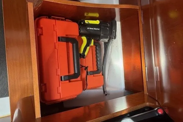 Slide: The Image of Storage compartment on a 2002 Beneteau First 36.7 with tool case and equipment. - 41