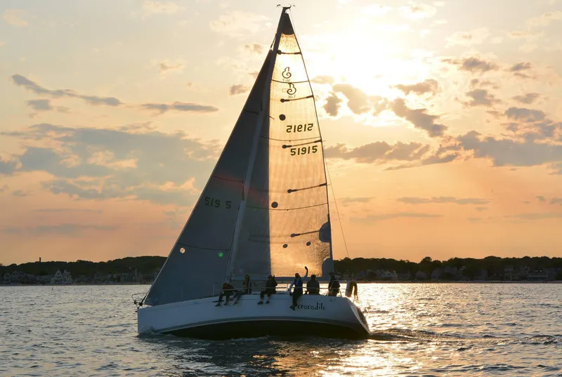Slide: The Image of Sailing yacht Beneteau First 36.7 (2002) at sunset on calm waters. - 46