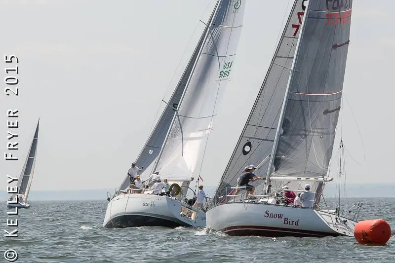 Slide: The Image of Sailboats racing on open water, featuring a 2002 Beneteau First 36.7. - 48