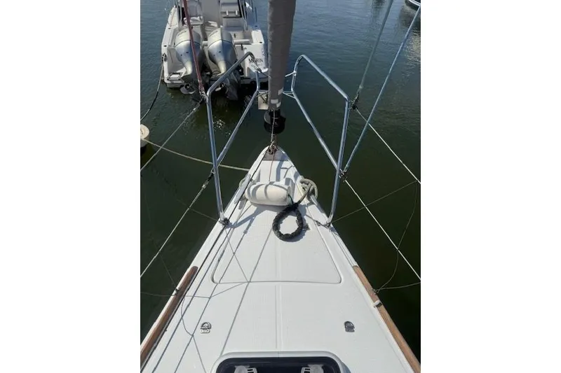 Slide: The Image of Bow of a 2002 Beneteau First 36.7 sailboat docked in a marina. - 5